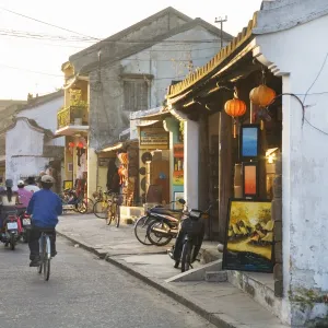 Street with shops and people in Vietnamese town