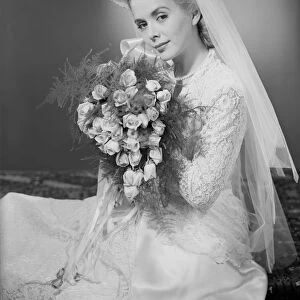 Studio portrait of mid adult bride