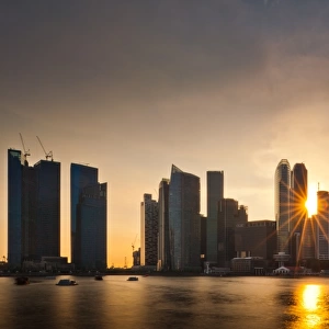 Sunlight shine through Singapore skylines