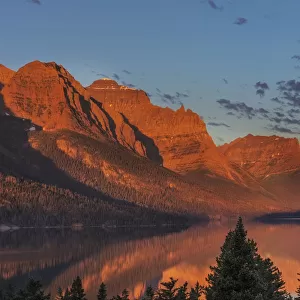 Sunrise clouds over Wild Goose Island and St. Mary Lake in Glacier National Park, Montana, USA