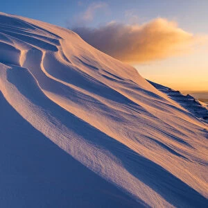 Sunrise light on snowdrifts, high up in the High Peak of Derbyshire