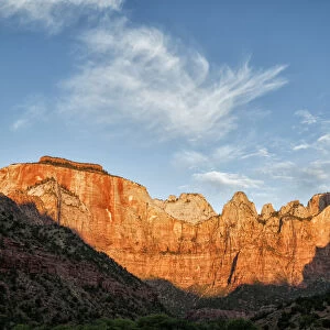 Sunrise warms Towers of Virgin, Zion National Park, Utah, USA