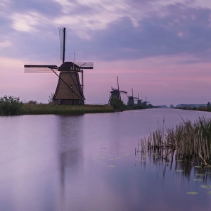 Sunrise on windmills Kinderdijk Holland
