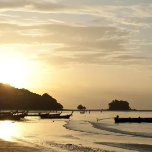 Sunset at the beach, fishing boats in silhouette, Nai Yang Beach, Phuket, Phuket Province, Thailand Sunset at the beach, fishing boats in silhouette, Nai Yang Beach, Phuket, Phuket Province, Thailand