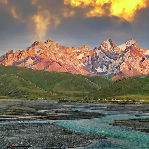 Sunset over the Central Tien Shan Mountains and glacier river, Kurumduk valley, Naryn province, Kyrgyzstan