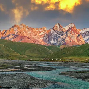 Sunset over the Central Tien Shan Mountains and glacier river, Kurumduk valley, Naryn province, Kyrgyzstan