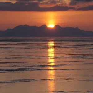 Sunset behind the mountains of the Isfjorden with reflections in the tidal flats, Longyearbyen, Spitsbergen, Svalbard, Norway, Europe Sunset behind the mountains of the Isfjorden with reflections in the tidal flats, Longyearbyen, Spitsbergen, Svalbard, Norway, Europe