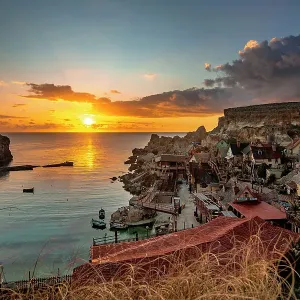 Sunset over Popeye Village, limits of Mellieha, Malta Sunset over Popeye Village, limits of Mellieha, Malta