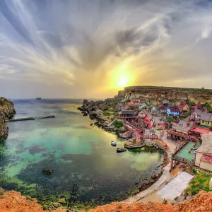 Sunset over popeye village on the Western coast of Malta Sunset over popeye village on the Western coast of Malta