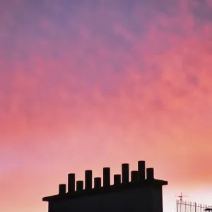 Sunset over a typical chimney in Paris, France Sunset over a typical chimney in Paris, France
