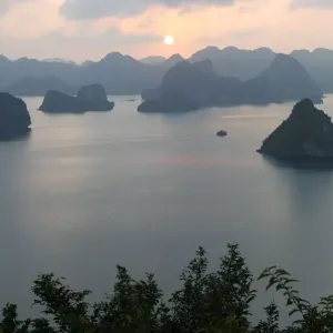 Sunset in the UNESCO-declared world natural heritage Halong Bay Viet Nam