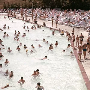 Swimming Pool With Many Men And Women In And Out O