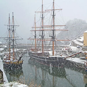 Tall sailing ships in Charlestown harbor England