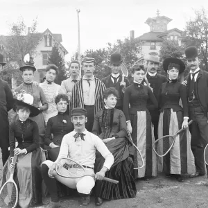 Tennis Team Posing in Front of Homes Tennis Team Posing in Front of Homes