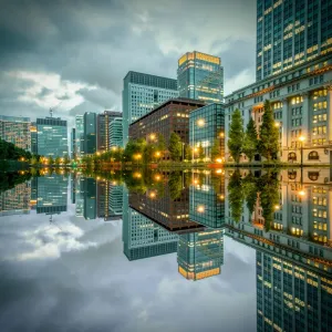 Tokyo Cityscape with skyscrapers and office buildings illuminated reflection in Hibiya Tokyo Cityscape with skyscrapers and office buildings illuminated reflection in Hibiya