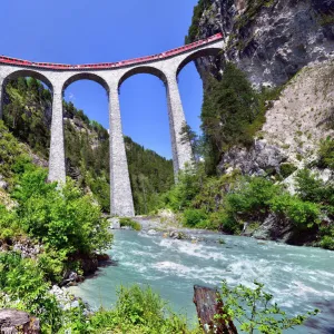 A train of the Rhaetian Railway on the Landwasser Viaduct, UNESCO World Heritage Site, near Filisur, Canton of Grisons, Switzerland