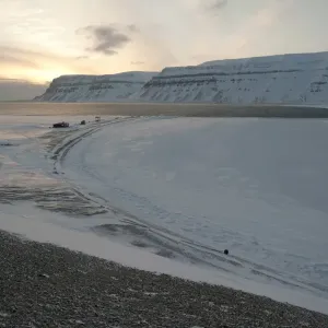 Trapper huts at Cape Schoulz at sunset on the partially frozen Tempelfjorden, Spitsbergen, Svalbard, Norway, Europe Trapper huts at Cape Schoulz at sunset on the partially frozen Tempelfjorden, Spitsbergen, Svalbard, Norway, Europe