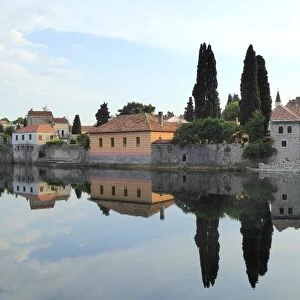 Trebinje reflected in the TrebiAanjica river, Bosnia and Herzegovina