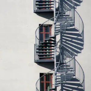 Triple Helix Stair Print with Brown Wood Frames and Glass Doors