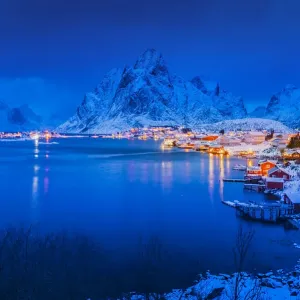 Twilight time of Idyllic coastal village at Reine in winter, Norway Twilight time of Idyllic coastal village at Reine in winter, Norway