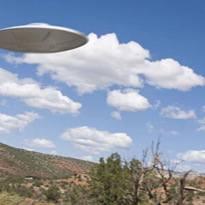 UFO flying over desert
