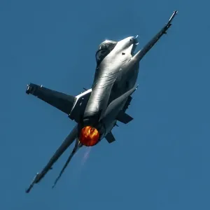 A USAF Lockheed Martin F-16C Viper going vertical in afterburner A USAF Lockheed Martin F-16C Viper going vertical in afterburner