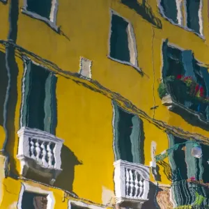 Venice, Veneto, Italy. Houses reflected into a street canals waters Venice, Veneto, Italy. Houses reflected into a street canals waters