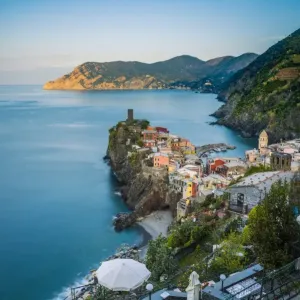 Vernazza, Cinque Terre, La Spezia, Liguria, Italy. The village and the reef in the early morning light in spring Vernazza, Cinque Terre, La Spezia, Liguria, Italy. The village and the reef in the early morning light in spring