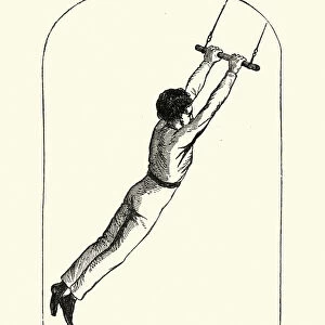 Victorian boy swinging on a trapeze