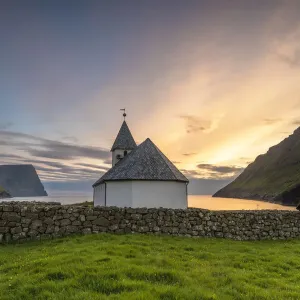 Vidareidi village, Vidoy island, Faroe Islands, Denmark. Villages church at sunset Vidareidi village, Vidoy island, Faroe Islands, Denmark. Villages church at sunset