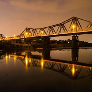 Vietnam - Reflections of Long Bien bridge on Song Hong river, Hanoi