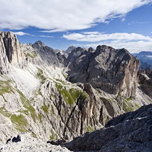 View during the ascent to the Croda Rossa in the Rose Garden Group over the Croda Rossa via ferrata, below the Vaiolonpass, behind the Tscheiner tips and the Rosengarten group with Kesselkogel, Dolomites, Province of South Tyrol, Italy