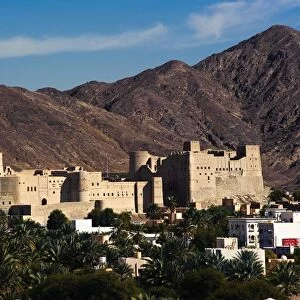 A view of Bahla Fort with the Hajar Mountains in the background. Northern Oman