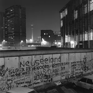 View over the Berlin Wall in 1985, towards the TV Tower at Alexanderplatz in East Berlin, at night, Berlin, Germany, Europe