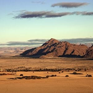 View from Elim Dune onto grass steppe, Sesriem Camp and Tsaris Mountains, Namib Desert