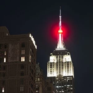 View of the top of the empire state Buildin at night in Manhattan, New York City