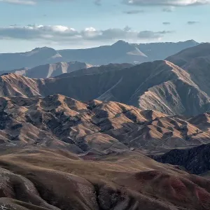View over eroded mountainous landscape with brown hills, Konorchek Canyon, Chuy, Kyrgyzstan View over eroded mountainous landscape with brown hills, Konorchek Canyon, Chuy, Kyrgyzstan