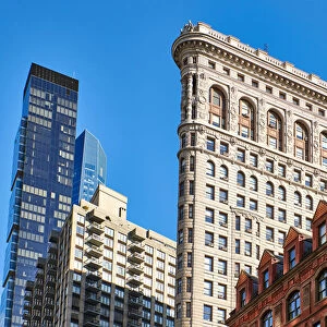 Side view of the Flatiron Building with surrounding buildings in the background against