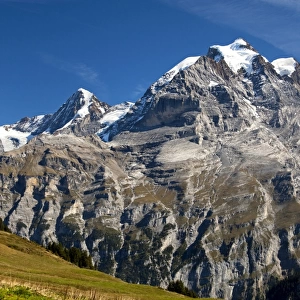View of Mt. Eiger, Mt. Moench and Mt. Jungfrau, from left to right; UNESCO World Heritage Site Jungfrau-Aletsch protected area, Muerren, Bernese Oberland, Switzerland, Europe