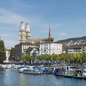 View from Quaibruecke bridge over the Limmat river to the marina with the Limmat quay, the twin towers of the Grossmuenster church at back, Zurich, Canton of Zurich, Switzerland, Europe