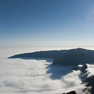 View from the summit, bright sun, Piton des Neiges Mountain, 3069 m, above the clouds, near Cilaos, French Overseas Territory, La Reunion