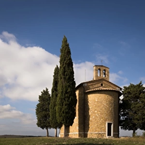 Back of Vitaleta chapel surrounded by Cypress trees, Val d Orcia