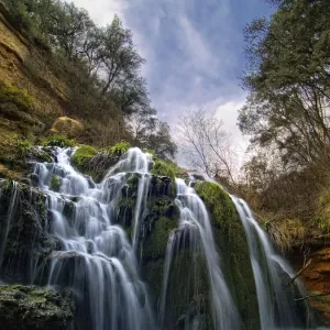 Waterfall called Blue Lake among ravines oaks Waterfall called Blue Lake among ravines oaks