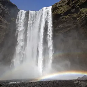 Waterfall with a rainbow, Skogafoss, Iceland Waterfall with a rainbow, Skogafoss, Iceland