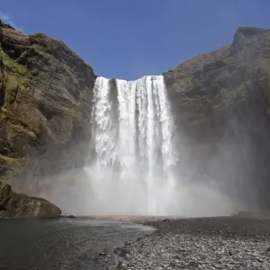 Waterfall with a rainbow, Skogafoss, Iceland Waterfall with a rainbow, Skogafoss, Iceland