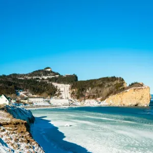 White Landscapes Print: Percé Townscape in Winter White Landscapes Print: Percé Townscape in Winter