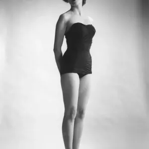 Woman in black corset posing in studio (B&W) Woman in black corset posing in studio (B&W)