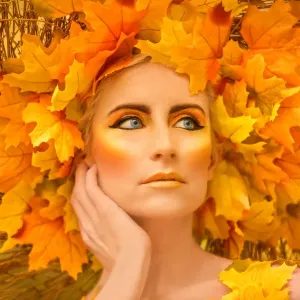 Woman in fall fashion modeling in a Fall scene Woman in fall fashion modeling in a Fall scene