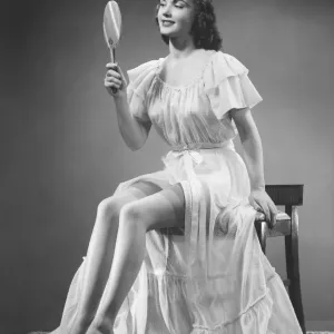 Black and White Print of Woman Examining Hand Mirror Black and White Print of Woman Examining Hand Mirror