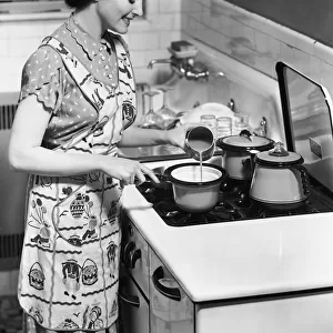 Woman preparing food on stove